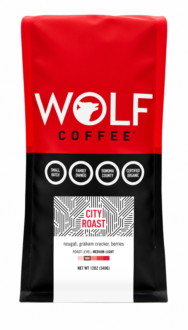 Wolf Coffee City Roast medium-light organic coffee, 12 oz red and black bag on white background